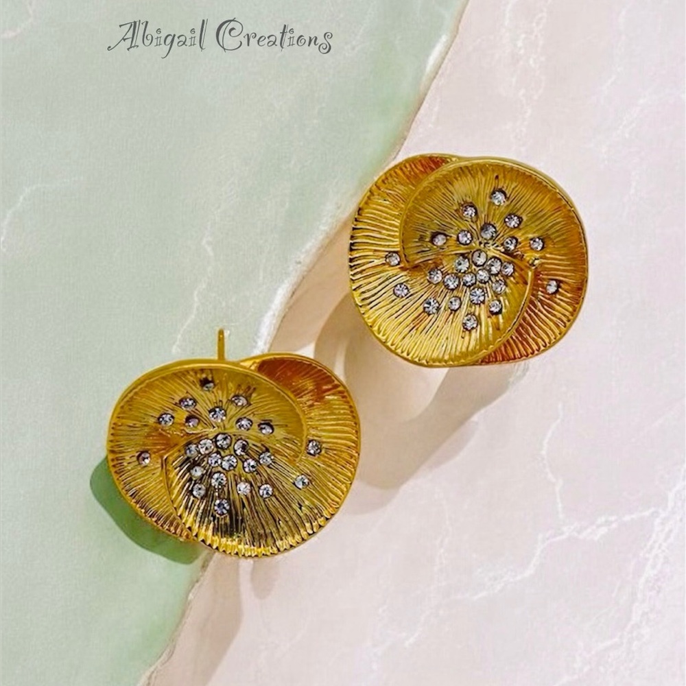 Elegant pair of gold-toned, exaggerated petal stud earrings